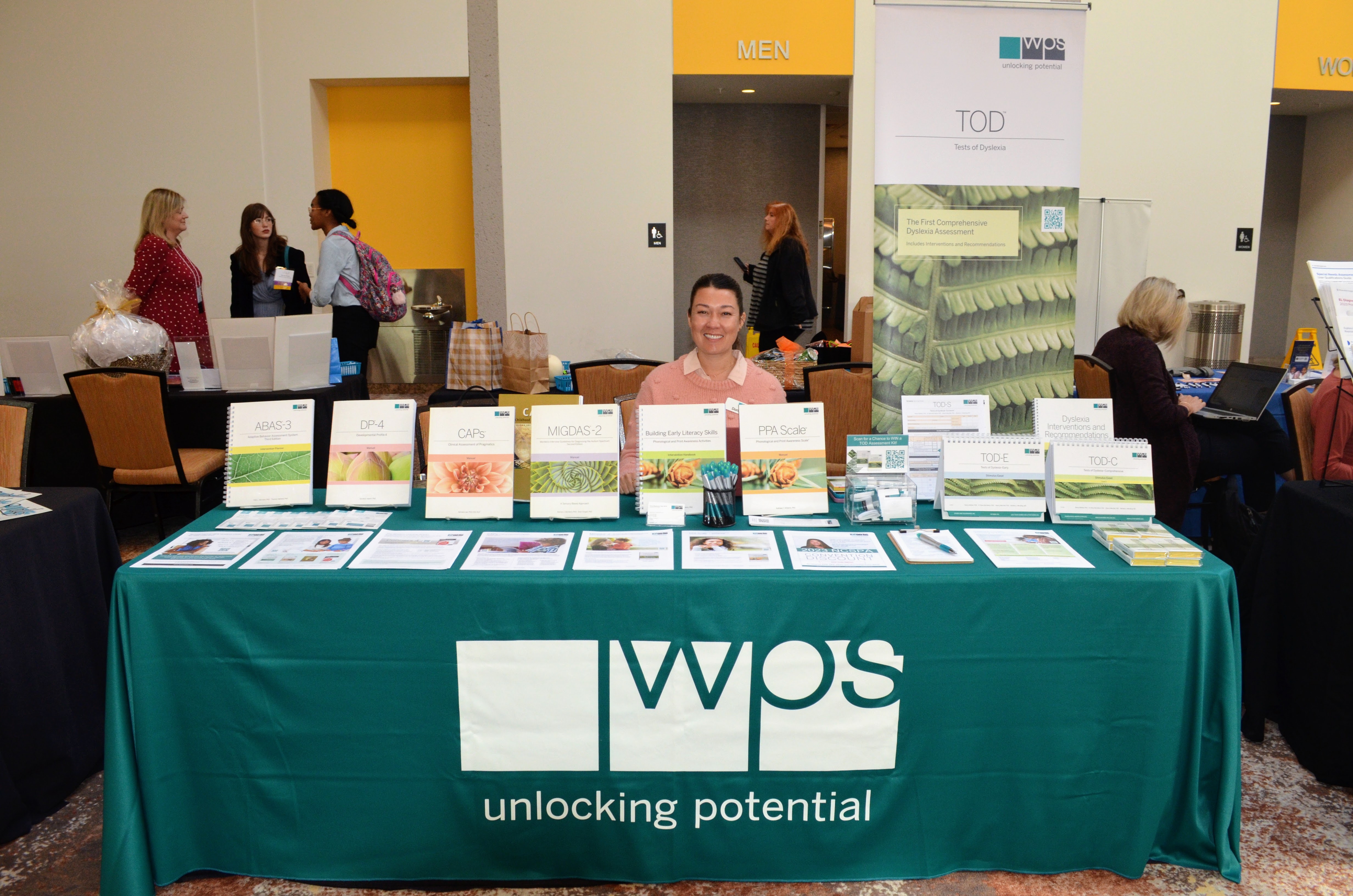 Person sitting at an exhibitor table